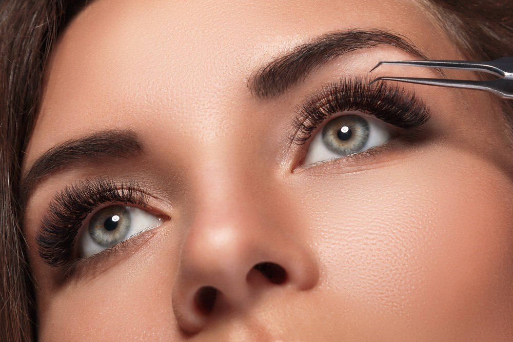 Why is it not recommended that you apply hair by hair lash extensions at home?